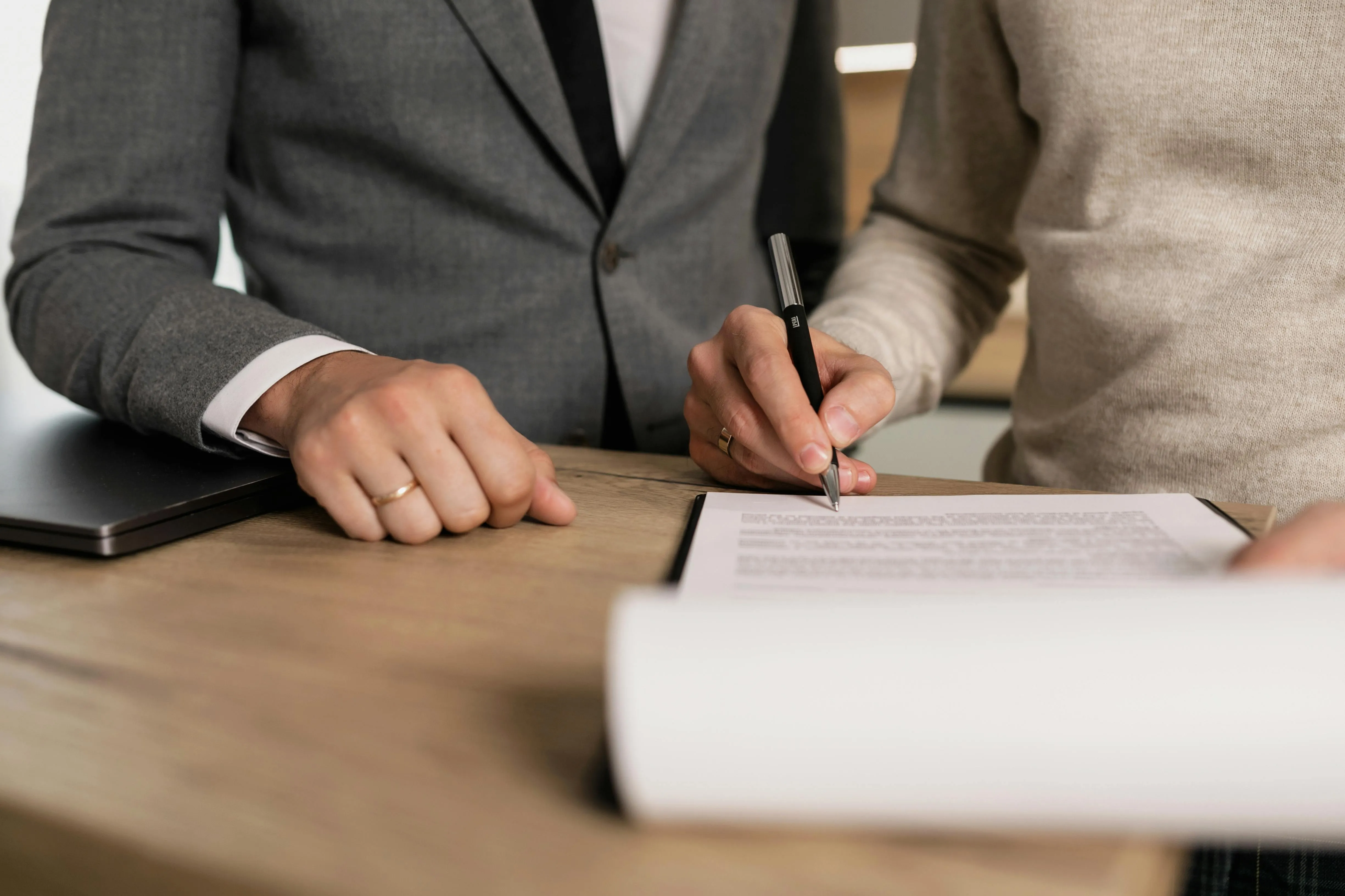 Two people reviewing a document